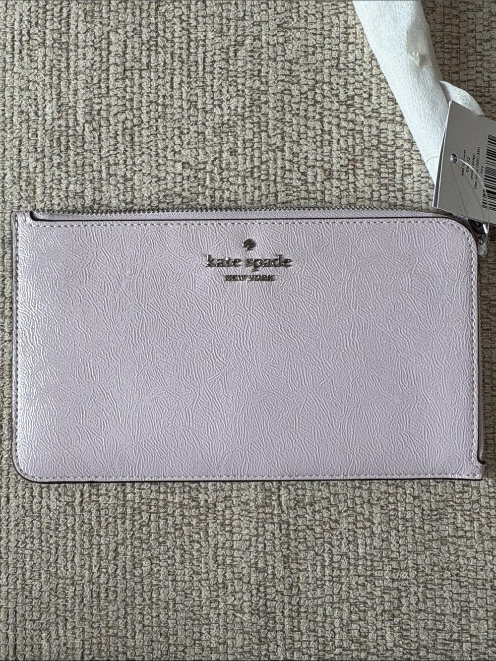 kate spade pale pink glossy zip-around wristlet